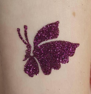 Pink butterfly glitter tattoo